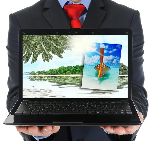 Businessman holding an open laptop — Stock Photo, Image