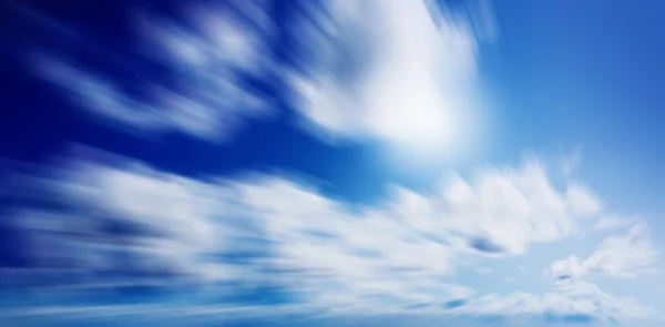 Blue sunny sky with clouds — Stock Photo, Image