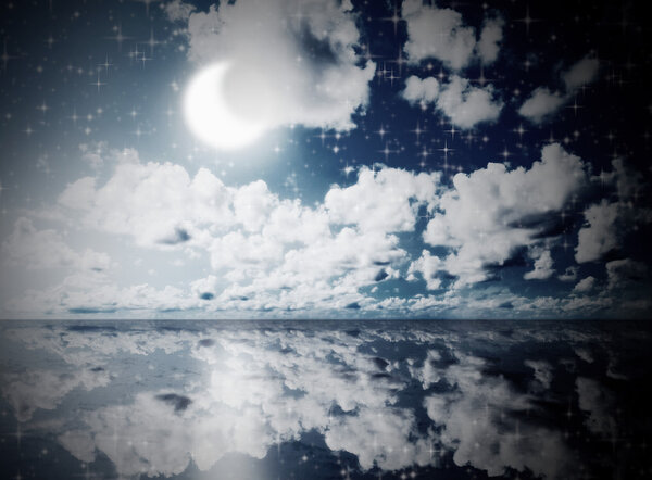Image of beautiful blue sunny sky with clouds reflected in the water