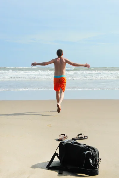 Man runs into the sea — Stock Photo, Image