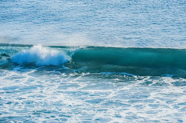 Swirled blue colored ocean wave — Stock Photo, Image