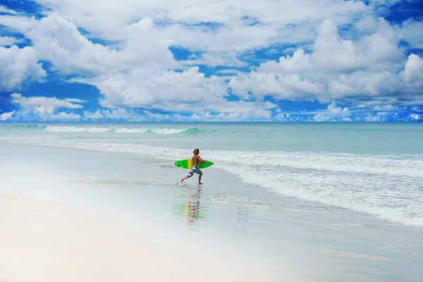 Athletic surfer with board — Stock Photo, Image