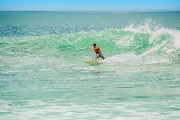 Athletic surfer with board — Stock Photo, Image