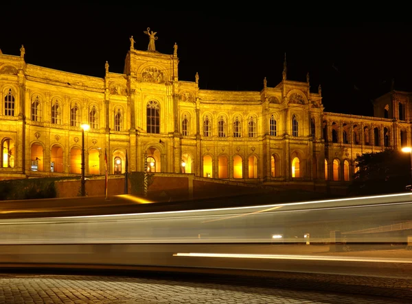 Munich - Maximilianeum at night with rays from a street car — Stock Photo, Image