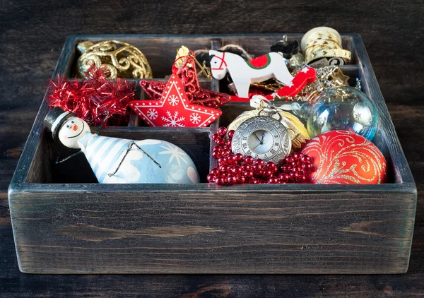 Wooden box with Christmas toys, gifts and decorations