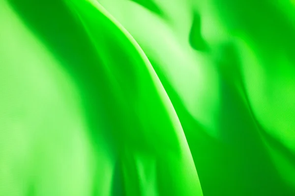 Schöner Hintergrund, fliegender grüner Stoff — Stockfoto