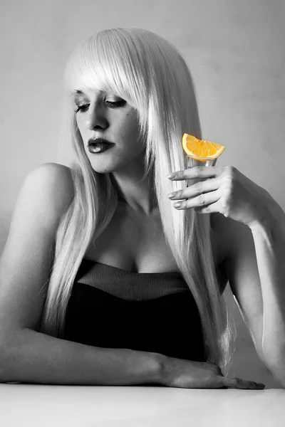 Beautiful blonde in a bar drinking tequila — Stock Photo, Image