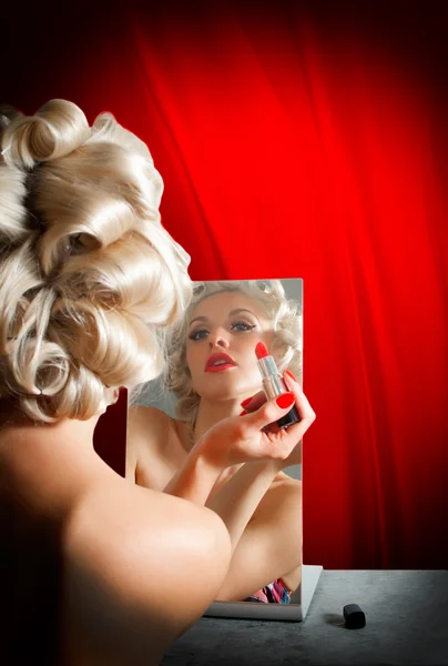 Retro Woman Applying Lipstick in Mirror