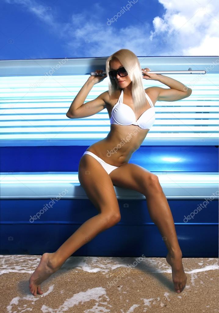 Woman sunbathing in the solarium