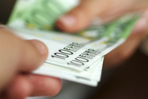 Hands with euros. — Stock Photo, Image