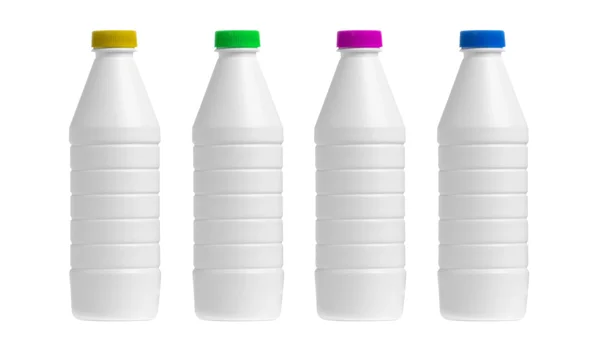 Vier fles van melk met een caps gekleurde geïsoleerd op witte backgr — Stockfoto