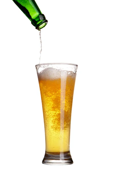 Beer pouring from green bottle into glass isolated on white — Stock Photo, Image