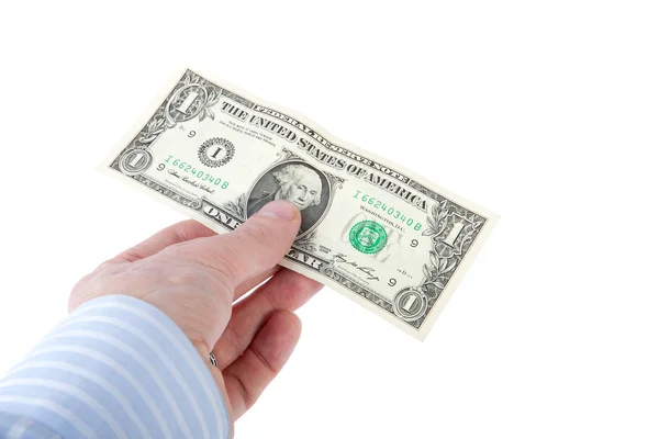 bir dolarlık banknot tutan bir erkek eli.