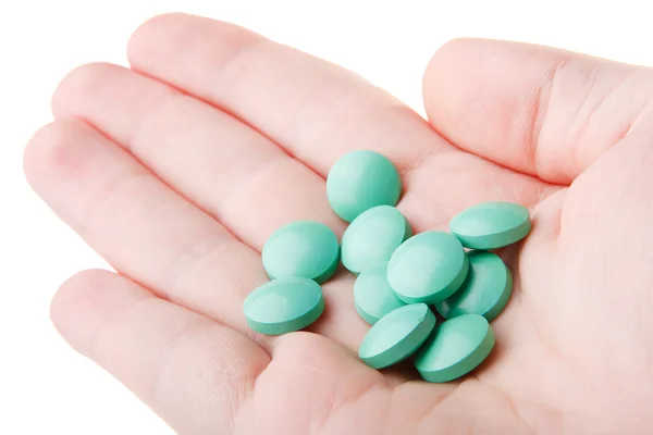 Mani con pillole isolate su sfondo bianco — Foto Stock