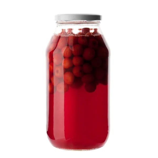 Бутылка вишневых фруктов на белом — стоковое фото