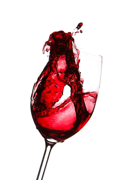 Red wine splashing in a glass, isolated on white — Stock Photo, Image