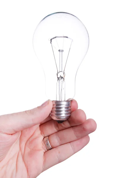 Bulb (lamp) in hand, isolated on white Royalty Free Stock Photos