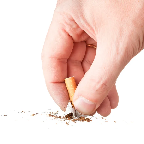 Hand extinguishing a cigarette on white — Stock Photo, Image