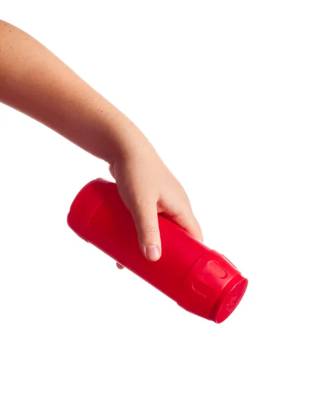 Red bottle with cleaning powder in hand isolated on white — Stock Photo, Image