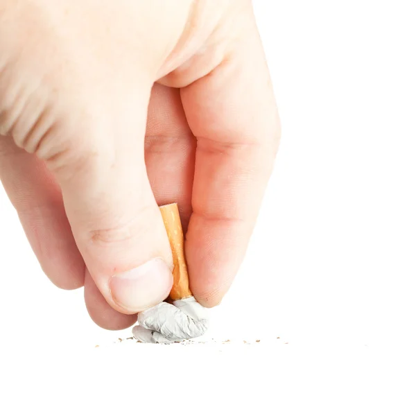 Hand extinguishing a cigarette on white — Stock Photo, Image
