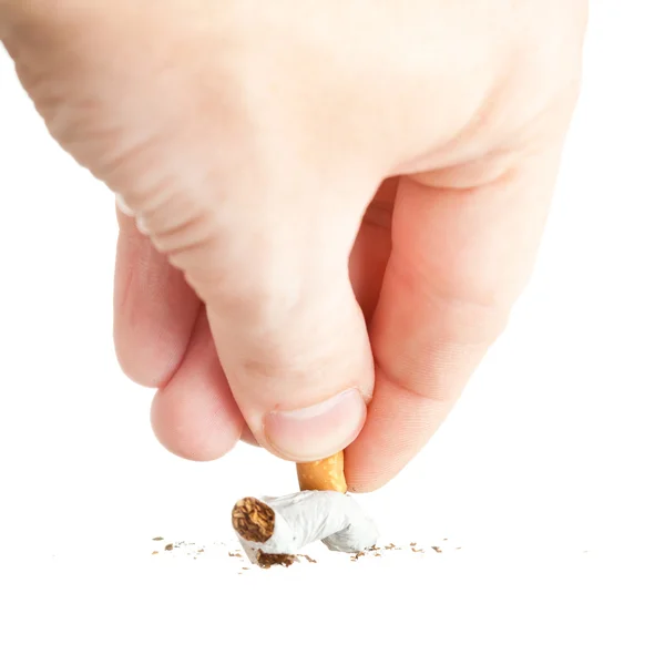 Hand extinguishing a cigarette on white — Stock Photo, Image