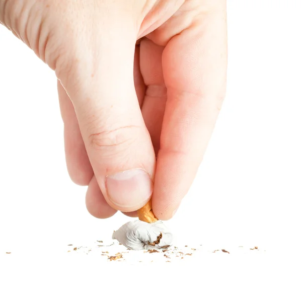 Hand extinguishing a cigarette on white — Stock Photo, Image