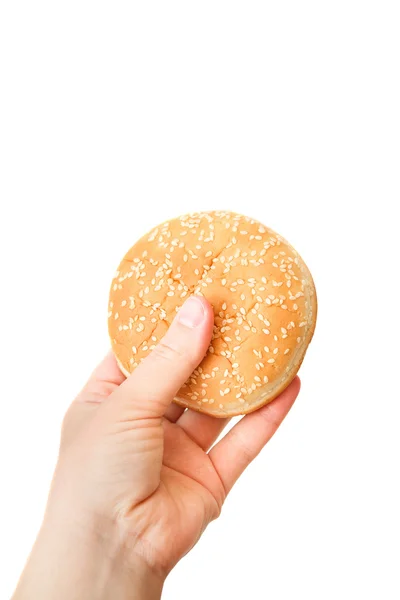 Közelkép kép-ból egy emberi kéz finom hamburgert át a w — Stock Fotó