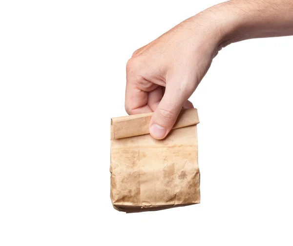 Paper bag in hand, isolated on white background — Stock Photo, Image