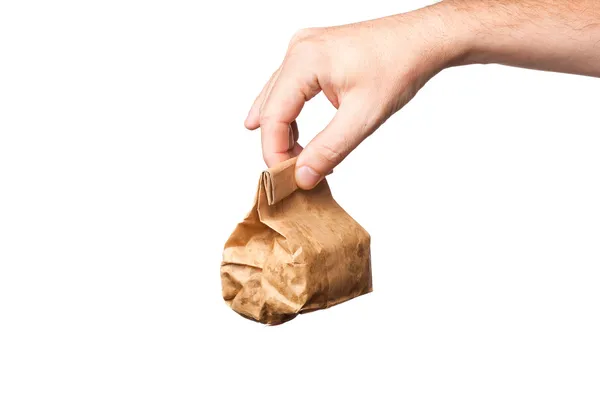 Paper bag in hand, isolated on white background — Stock Photo, Image