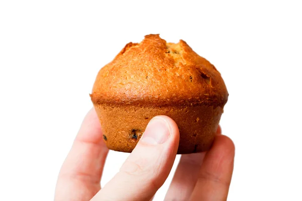 Muffin i handen på vit bakgrund — Stockfoto