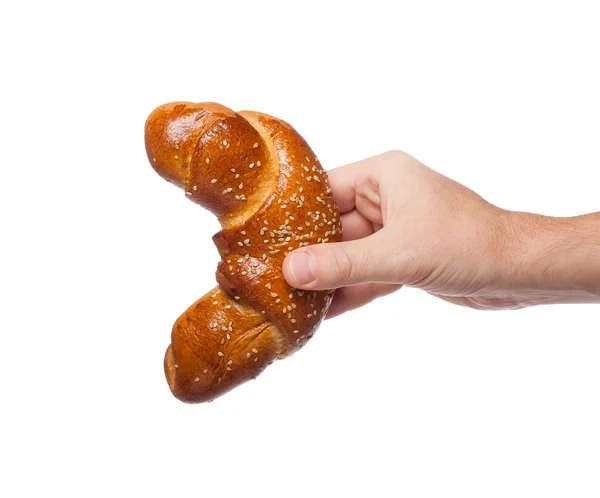 Brötchen in der Hand auf weißem Hintergrund — Stockfoto