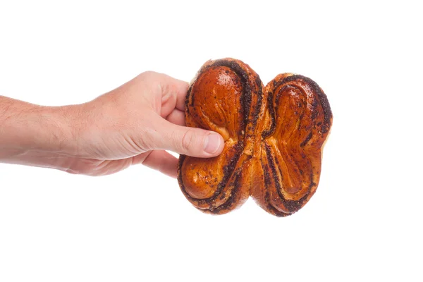 Brötchen in der Hand auf weißem Hintergrund — Stockfoto