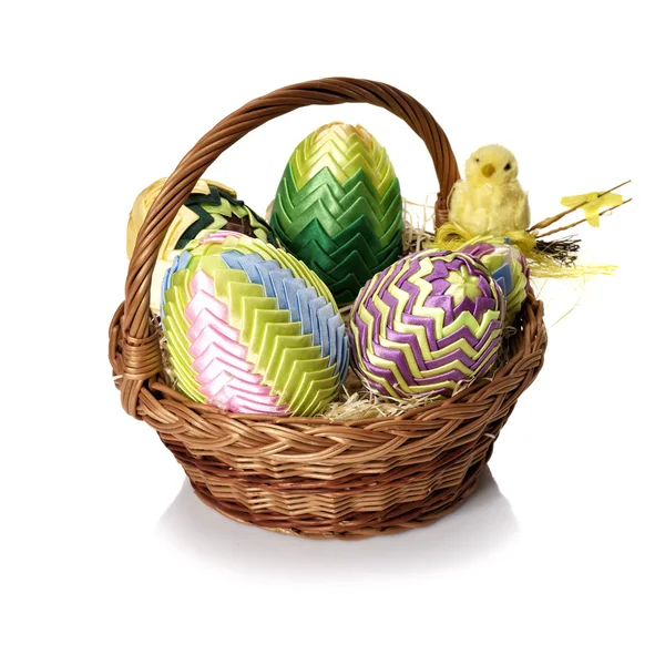 Easter eggs in wicker basket — Stock Photo, Image