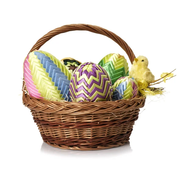 Easter eggs in wicker basket — Stock Photo, Image