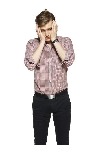 Young man against a white background — Stock Photo, Image