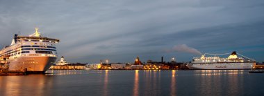 HELSINKI, FINLAND-DECEMBER 14: Silja Line and Viking Line ferries in port of the city of Helsinki clipart