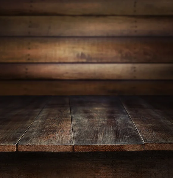 Old wooden table with wooden background — Stock Photo, Image