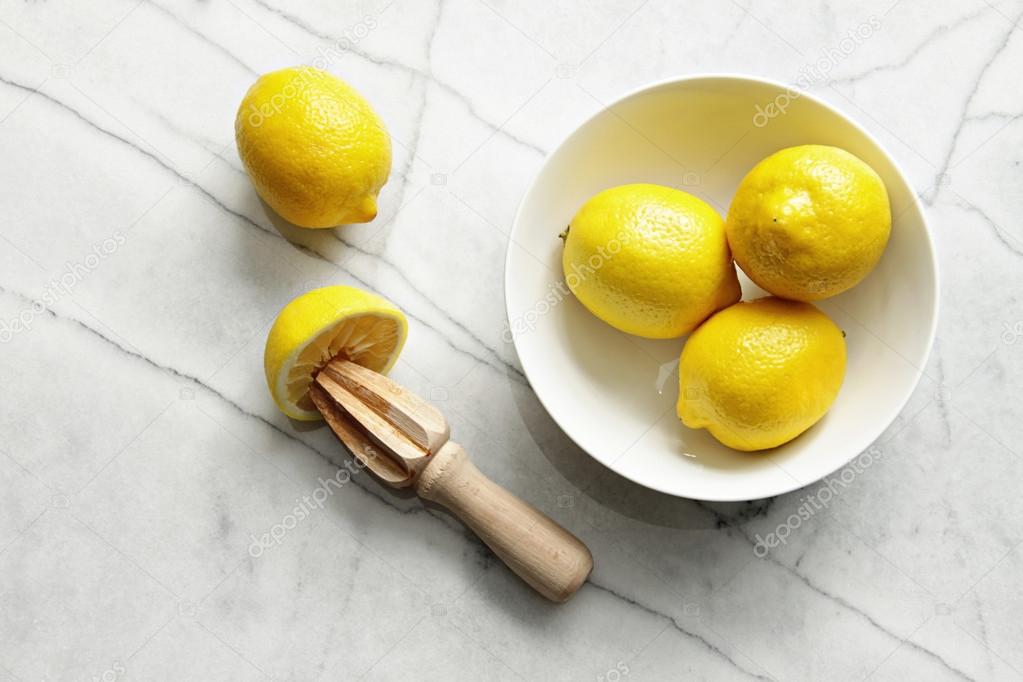 Fresh lemons on marble counter