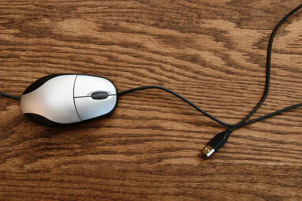 Computer mouse on wooden surface — Stock Photo, Image