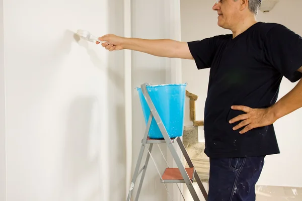 House painter painting wall Royalty Free Stock Photos