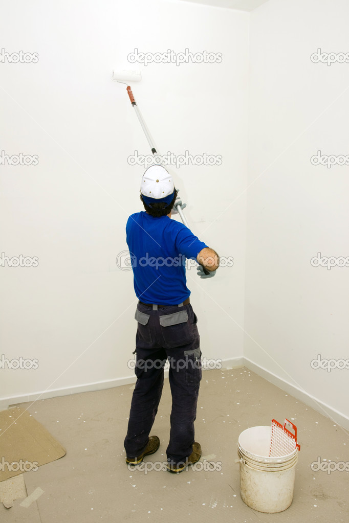 House painter painting wall