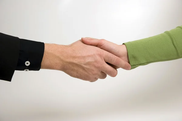 Man and woman are shaking hands — Stock Photo, Image