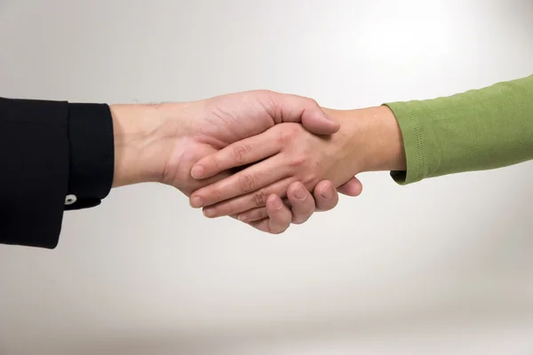 Man and woman are shaking hands — Stock Photo, Image