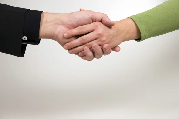 Man and woman are shaking hands — Stock Photo, Image