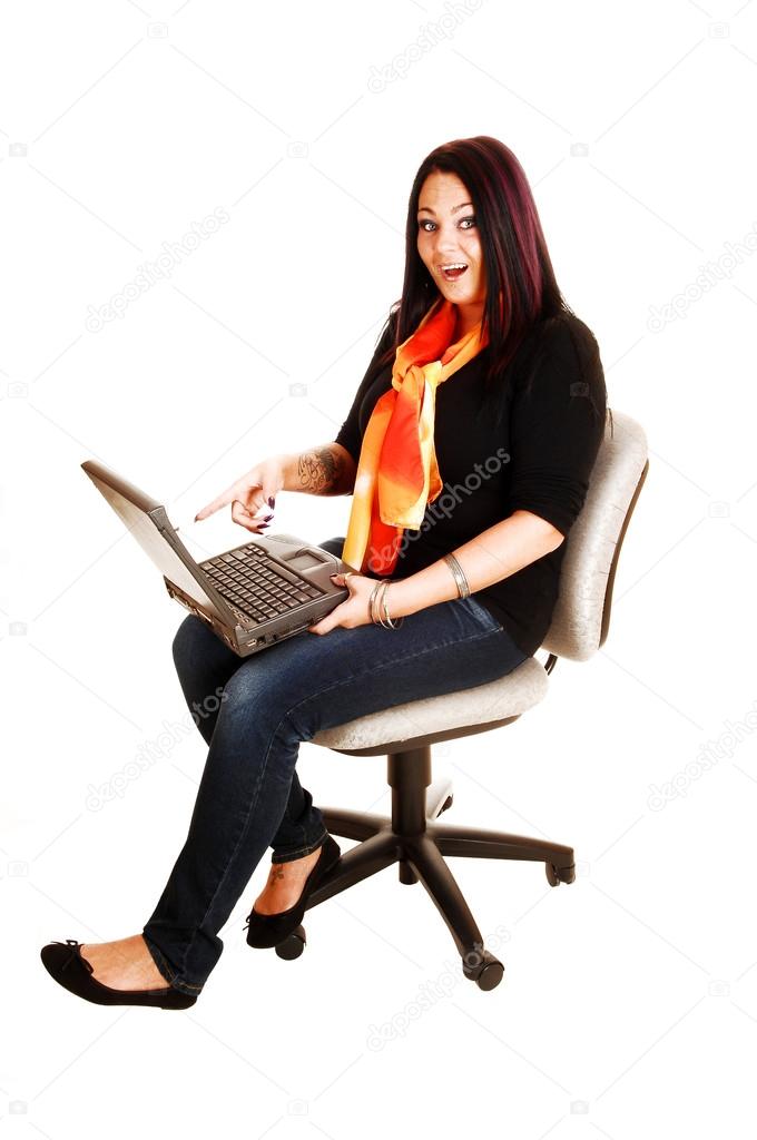 Girl playing with laptop.