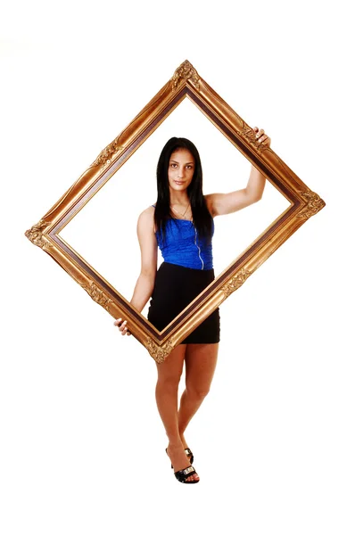 Girl holding a picture frame. — Stock Photo, Image