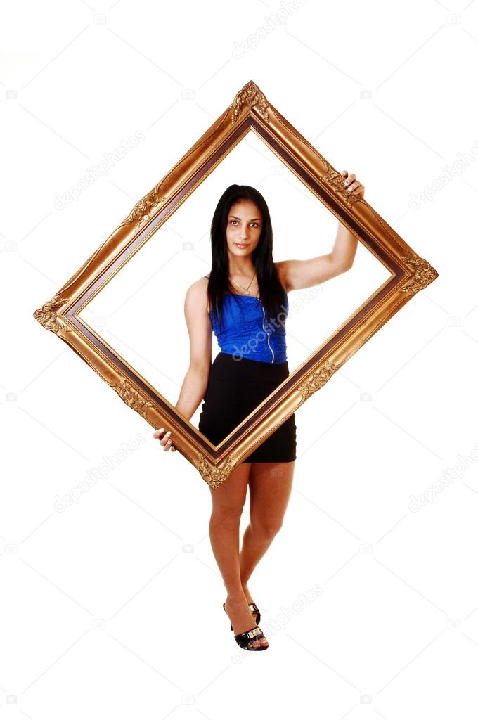 Girl holding a picture frame.