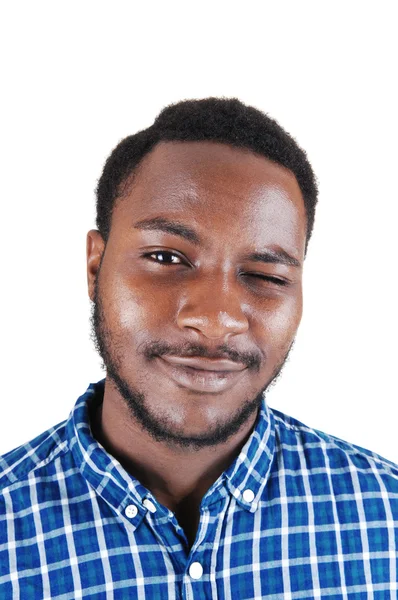 Black man blinking with his eye. — Stock Image Black man blinking with his eye. Royalty Free Stock Images