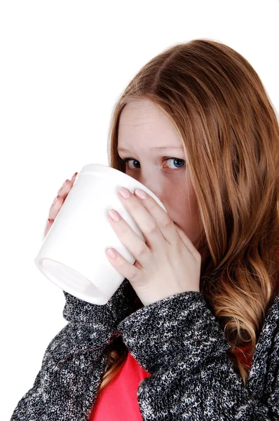 Girl drinking from big mug. — Stock Photo, Image