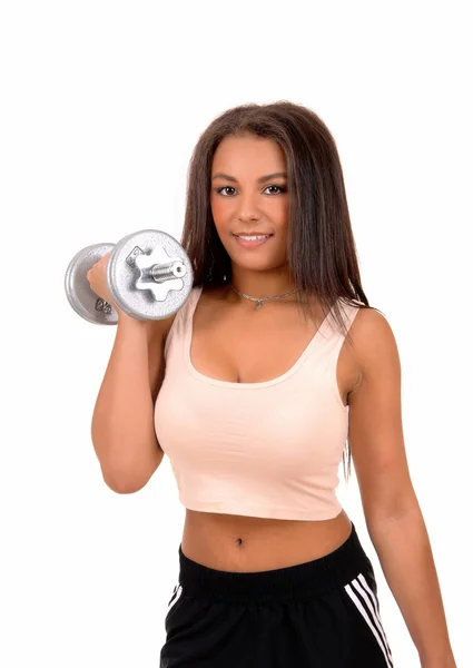Woman lifting a dumbbell. — Stock Photo, Image